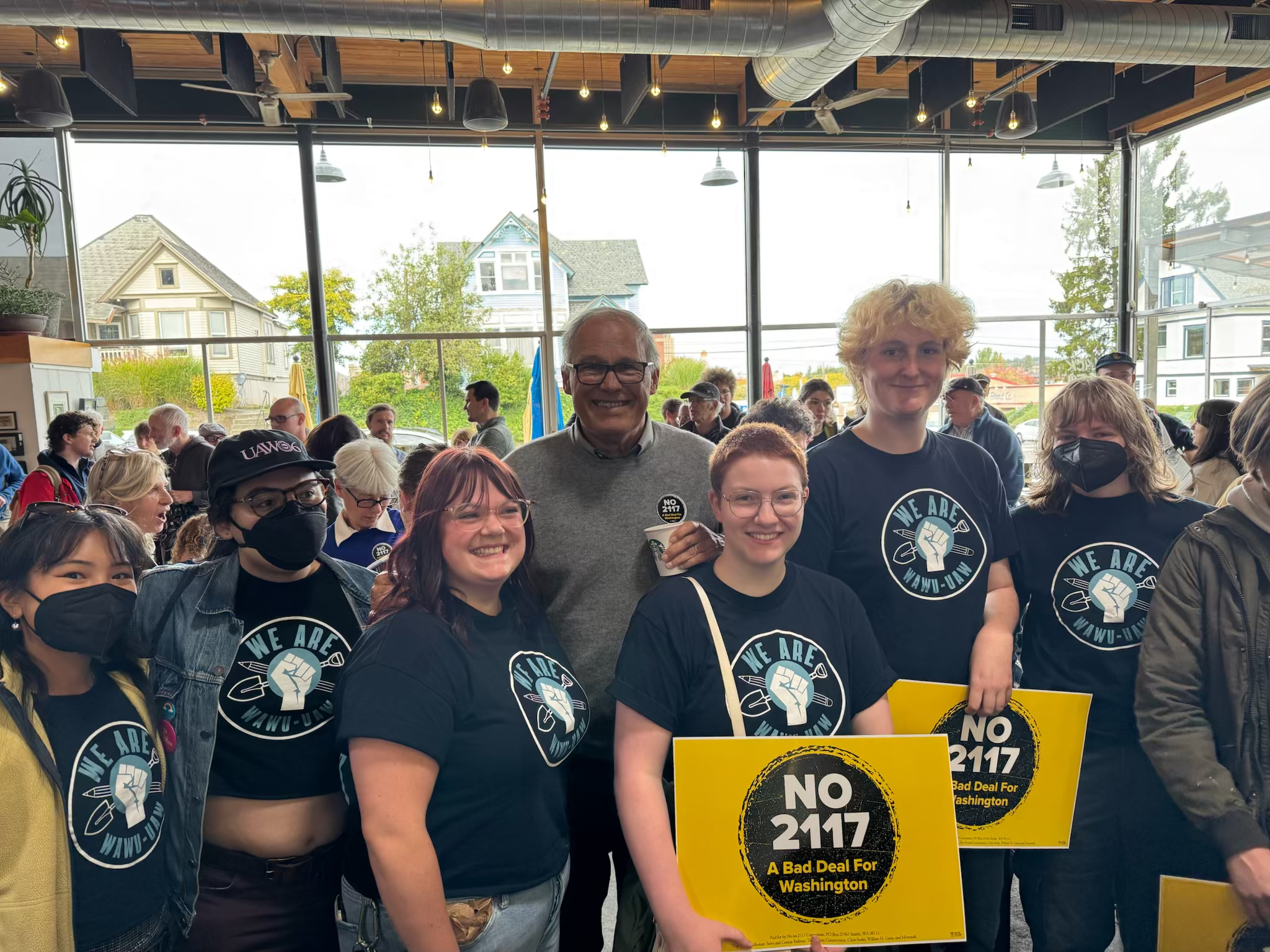 WAWU Members Posing for a picture with Governor Jay Inslee at Door Knocking event against State Initiative 2117.