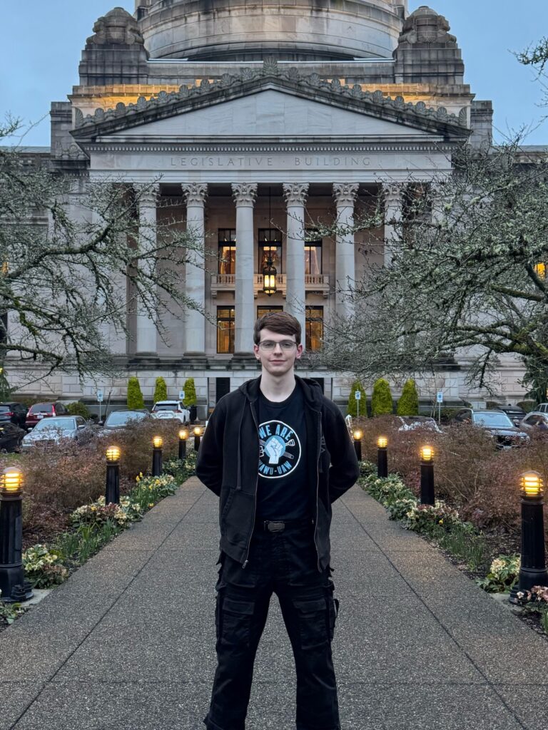 OSE Bargaining Committee Candidate Jase Kaeberlein, standing in front of the State Capitol Legislative Building
